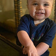 Wesson joined the competition — help win amazing prizes! toddler, child, smile, face, hands, blue_shirt, table, blocks, toy, indoor, happy, cute, young_child, person, playing, cheeks, short_hair, casual_clothing, closeup, home