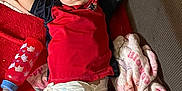 Wesson joined the competition — help win amazing prizes! toddler, sleeping, diaper, red_shirt, blanket, bottle, couch, child, nap, cozy, indoor, relaxed, young_child, clothing, furniture, person, pink, red, baby, resting