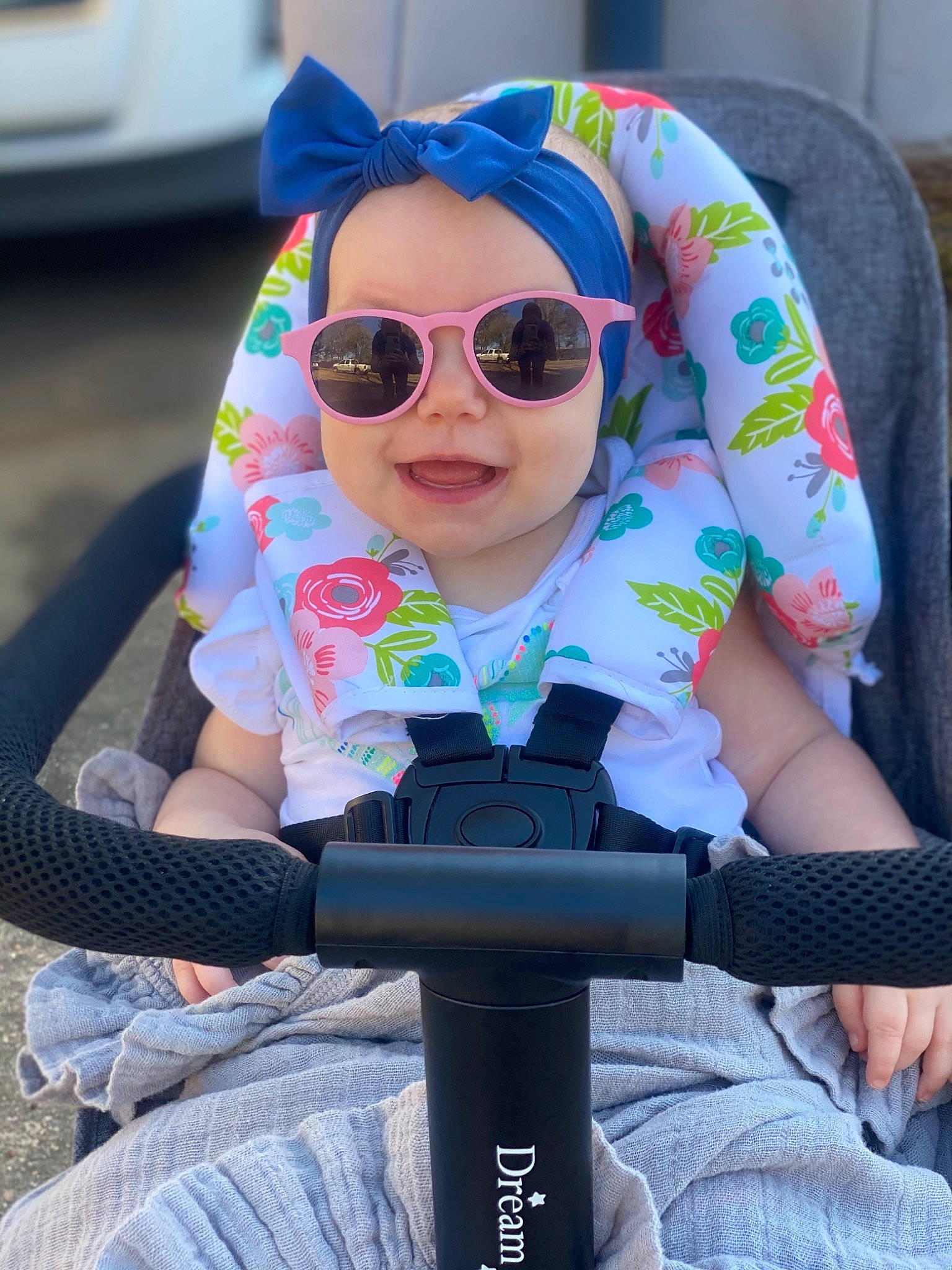 Sloane is registered to the contest to win money with this photo: auto_part, baby, baby_products, baby_toddler_clothing, car_seat, child, cool, electric_blue, eyewear, glasses, goggles, happy, person, personal_protective_equipment, pink, product, seat_belt, sitting, sunglasses, toddler