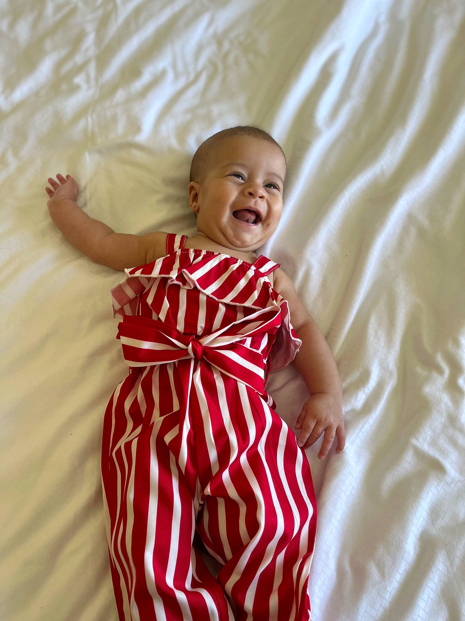 Avayah is registered to the contest to win money with this photo: abdomen, baby_toddler_clothing, comfort, day_dress, dress, eye, face, finger, gesture, happy, head, human_body, one_piece_garment, person, skin, sleeve, smile, textile, thigh, toddler