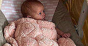 Sabriena joined the competition — help win amazing prizes! baby, blanket, pink, infant, soft_toys, baby_seat, cozy, wrapped, cute, newborn, face, portrait, child, resting, comfort, indoor, warm, sleeping_area, curious, small