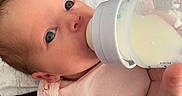 Sabriena joined the competition — help win amazing prizes! baby, baby_fashion, baby_hand, bottle, carpet, closeup, clothing, eyes, face, feeding, feeding_time, floor, hand, indoor, infant, milk, newborn, person, pink_outfit, skin