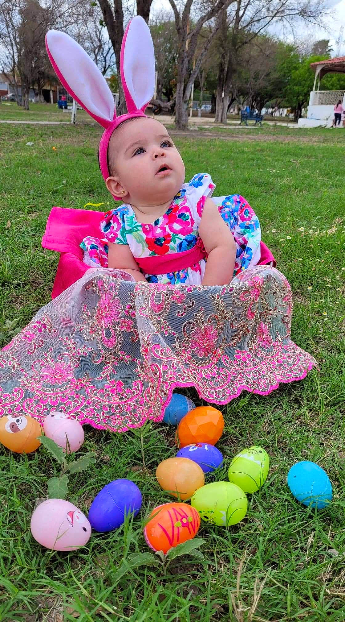 Yudith is registered to the contest to win money with this photo: baby_toddler_clothing, ball, blue, child, fun, grass, green, happy, leisure, mammal, people, people_in_nature, person, pink, plant, purple, recreation, summer, toddler, vertebrate