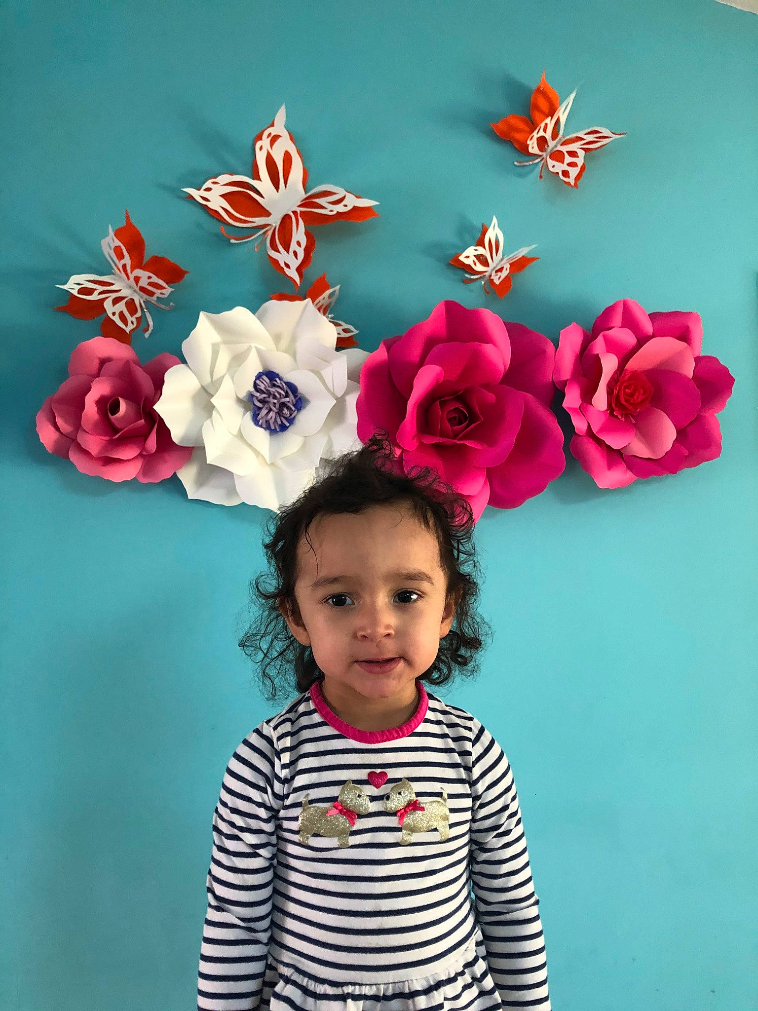 Fatima is registered to the contest to win money with this photo: child, fashion_accessory, flower, hair_accessory, happy, headgear, headpiece, paper, person, petal, photography, pink, plant, red, toddler