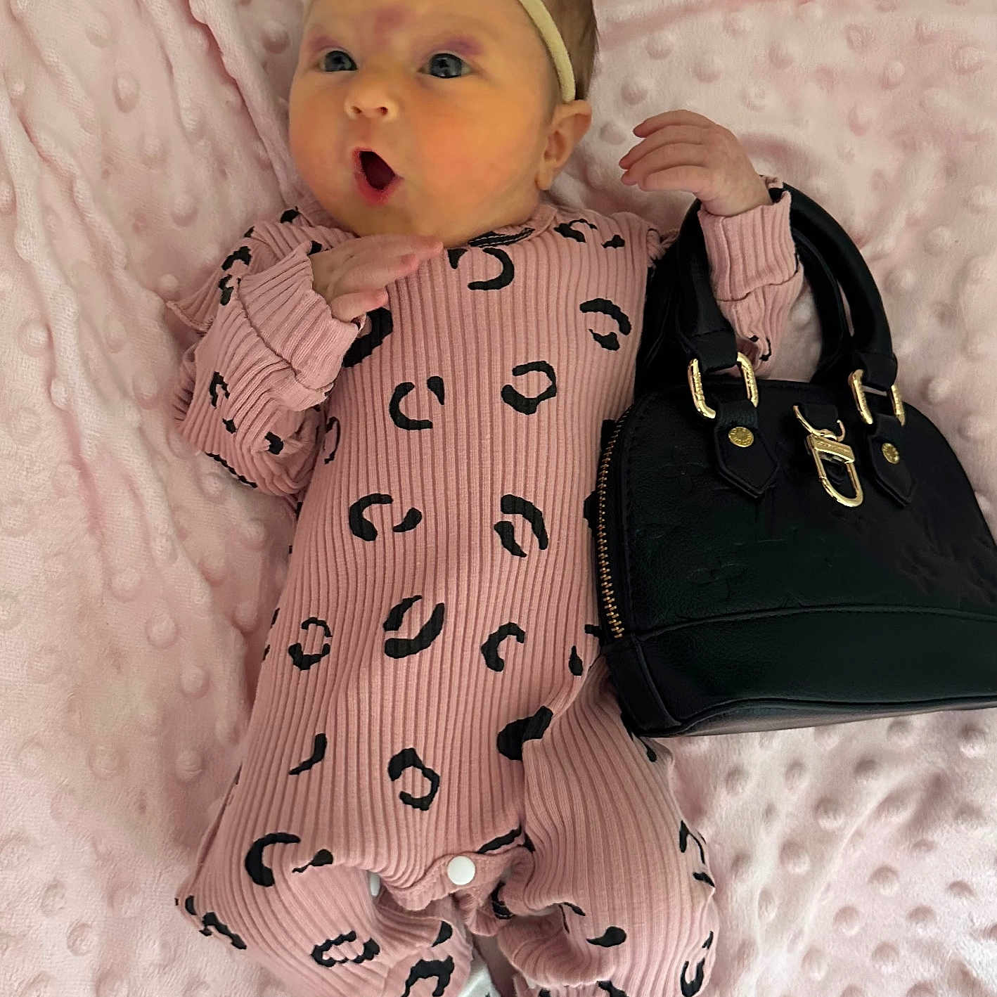 Lily joined the competition — help win amazing prizes! accessories, baby, bag, blanket, bonnet, cap, clothing, dress, face, handbag, hat, head, infantbed, person, purse, sitting, sleeve, yawning