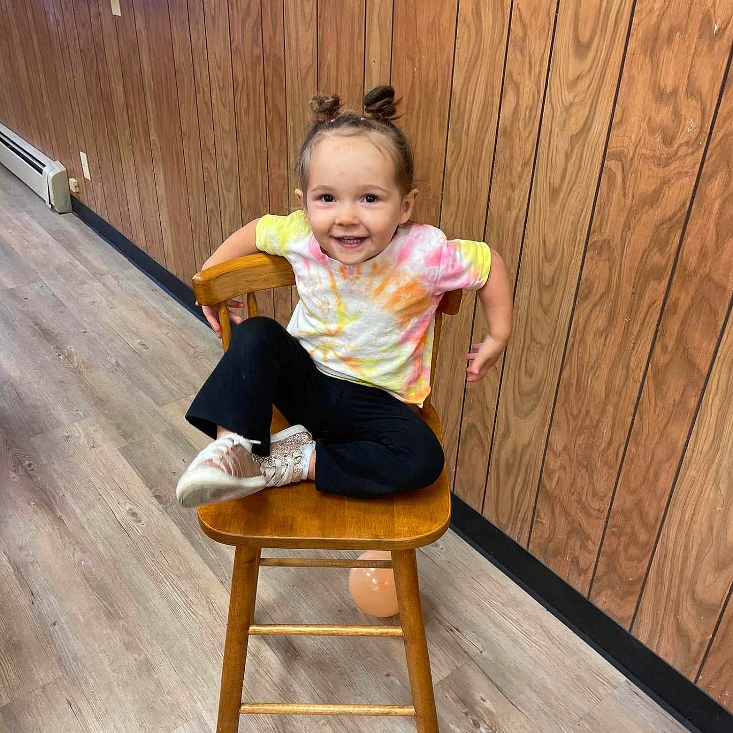 Eliana joined the competition — help win amazing prizes! chair, child, clothing, face, female, furniture, girl, happy, hardwood, head, highchair, indoors, interiordesign, jeans, pants, person, photography, portrait, sitting, stainedwood