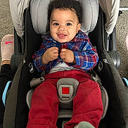 Micielo joined the competition — help win amazing prizes! baby, child, smiling, car_seat, plaid_shirt, red_pants, socks, infant, indoor, person, footwear, car_seat_harness, happy, cute, portrait, child_seat, car_seat_padding, car_seat_strap, car_seat_buckle, car_seat_cover