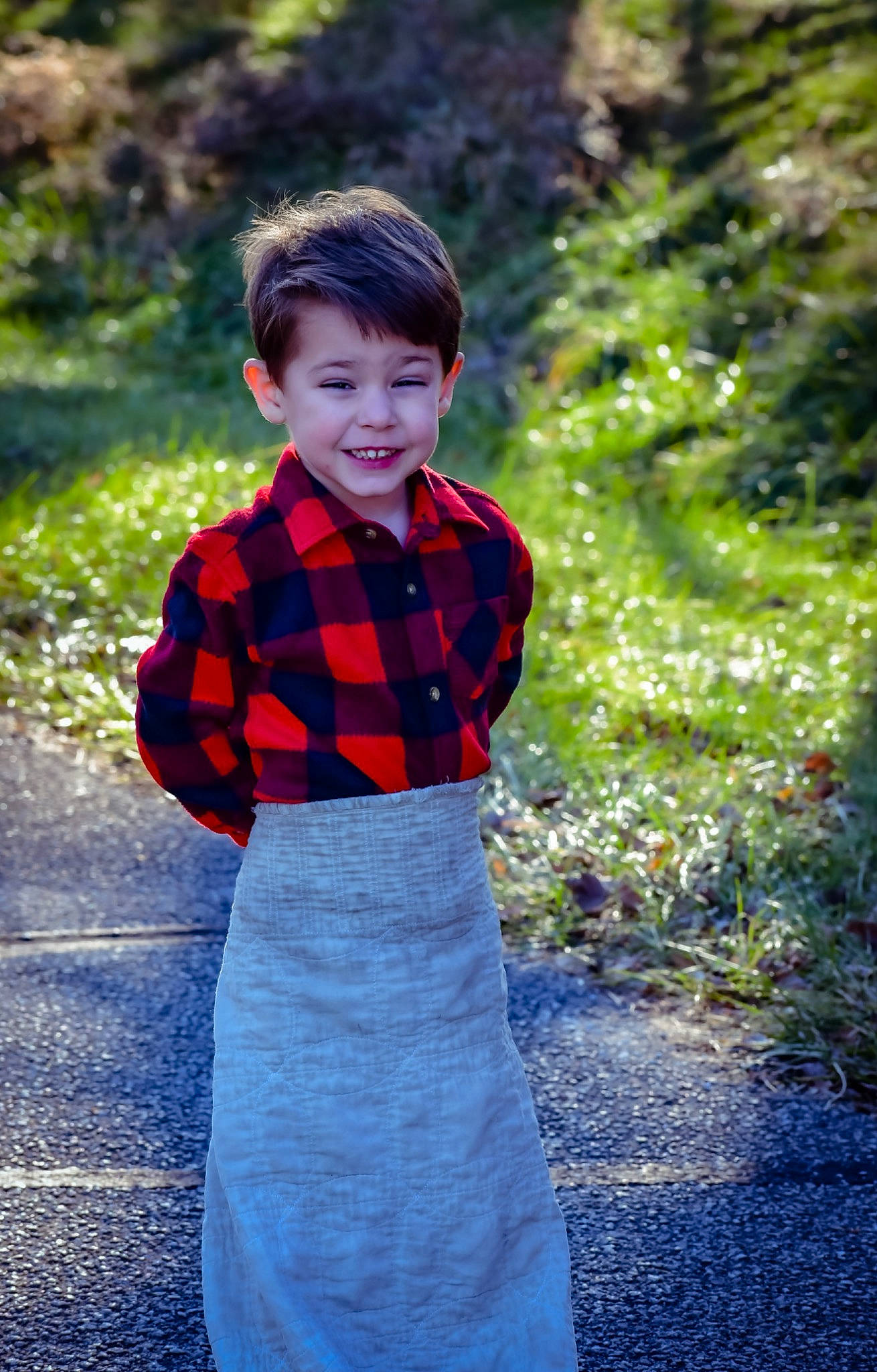 Saylor is registered to the contest to win money with this photo: baby_toddler_clothing, blue, child, electric_blue, flash_photography, fun, grass, hairstyle, happy, joy, outerwear, pattern, people_in_nature, person, plaid, plant, sleeve, smile, standing, tartan