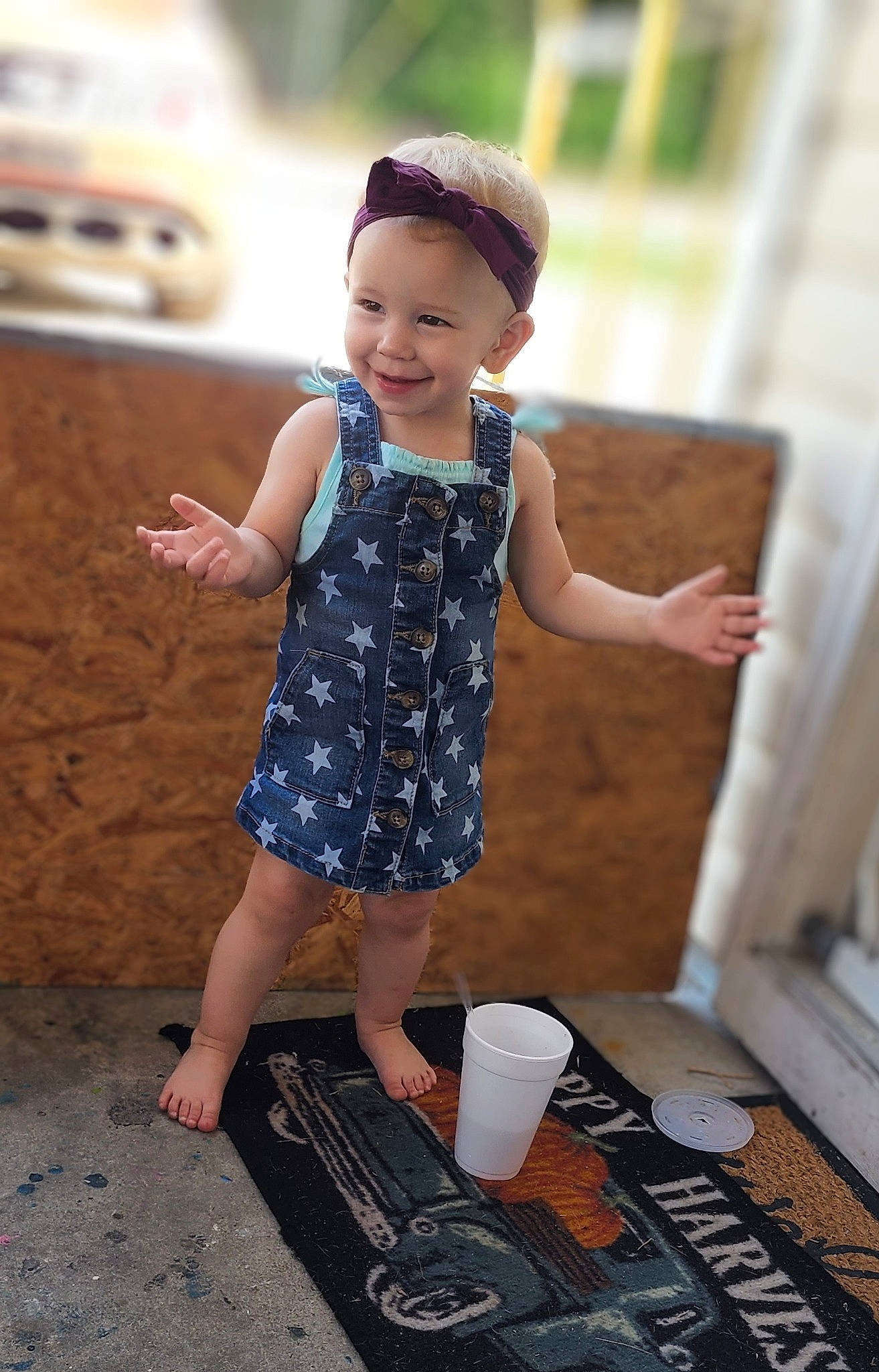 Augusta is registered to the contest to win money with this photo: baby_toddler_clothing, black, child, dress, fashion_design, finger, flash_photography, flooring, fun, happy, human_leg, joy, pattern, person, photograph, skin, sleeve, smile, snapshot, toddler