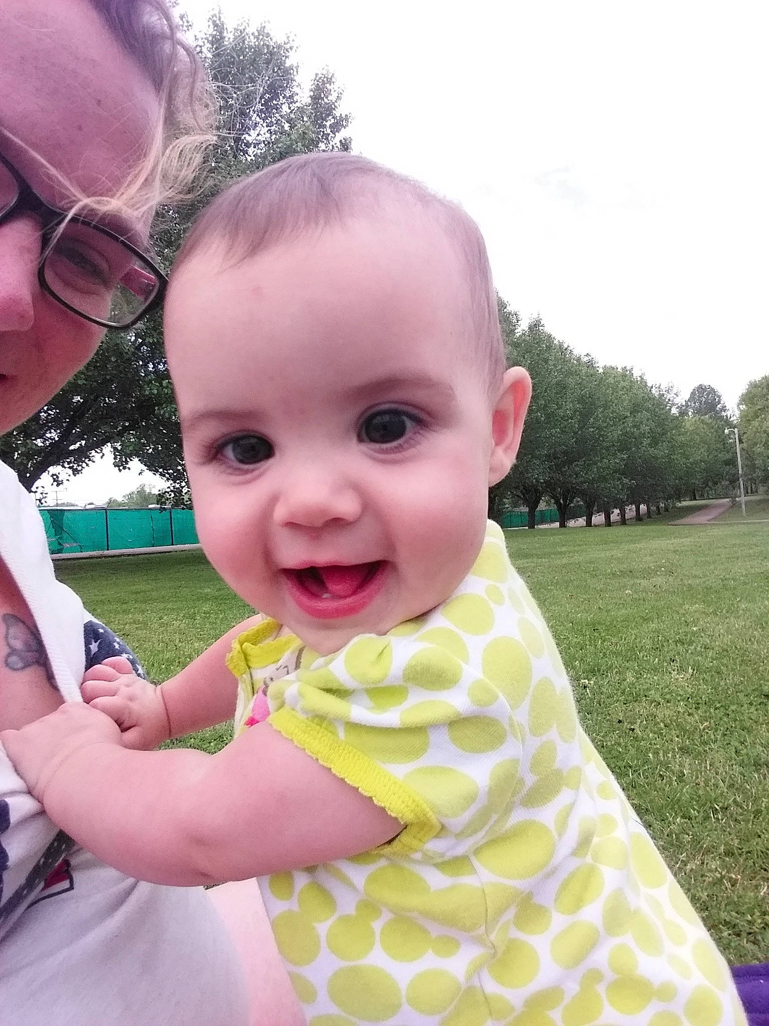 Alison is registered to the contest to win money with this photo: baby, beauty, cheek, child, eye, face, facial_expression, grass, head, joy, leaf, lip, nose, people, person, pink, skin, smile, summer, toddler