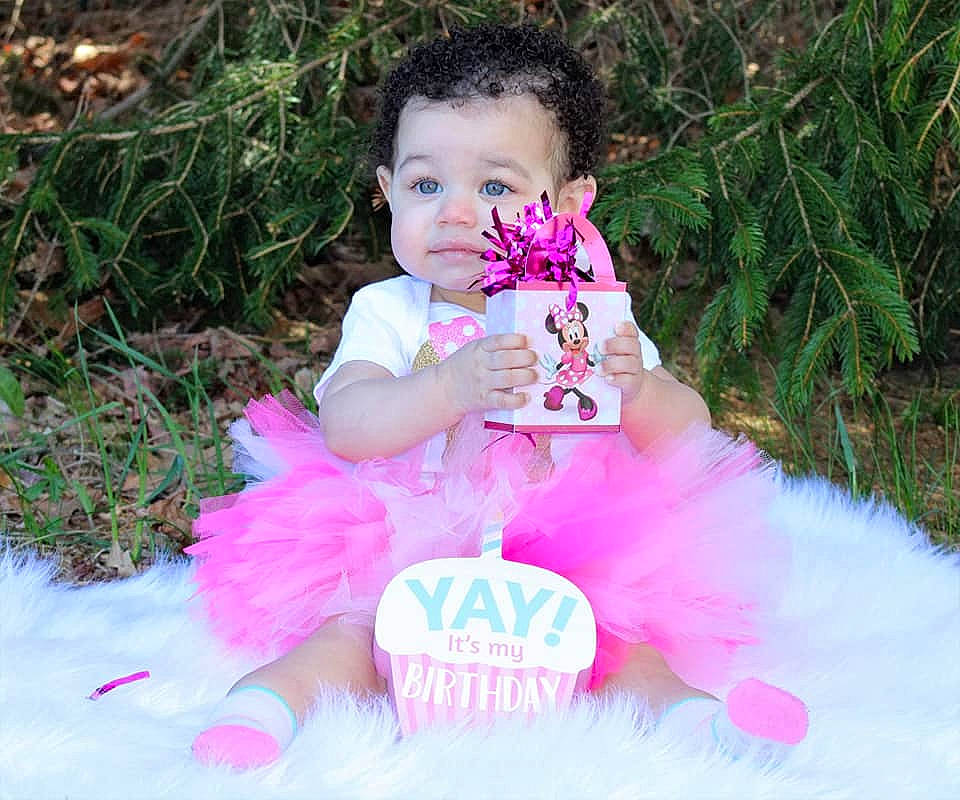 Jazlyn is registered to the contest to win money with this photo: baby, baby_products, baby_toddler_clothing, ballet_tutu, child, event, feather, fur, glove, grass, happy, leisure, magenta, mythical_creature, person, pink, plant, ruffle, toddler, toy