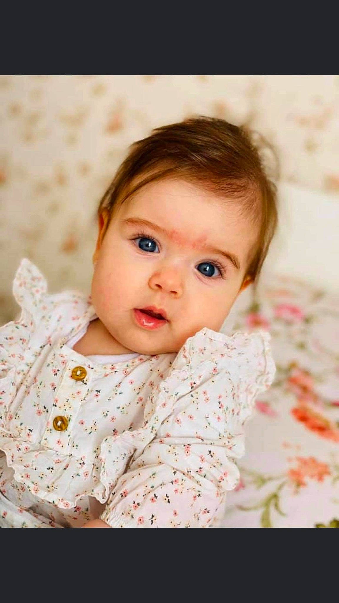 Stefania participe au concours pour gagner de l'argent avec cette photo : baby, baby_toddler_clothing, cheek, child, chin, collar, eye, eyelash, face, flash_photography, happy, head, iris, lip, pattern, peach, person, skin, sleeve, textile