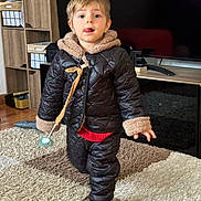 Chain participe au concours pour gagner de l'argent avec cette photo : boy, child, clothing, coat, face, footwear, hardwood, head, indoors, interiordesign, jacket, longsleeve, male, pants, person, photography, portrait, shoe, sleeve, wood