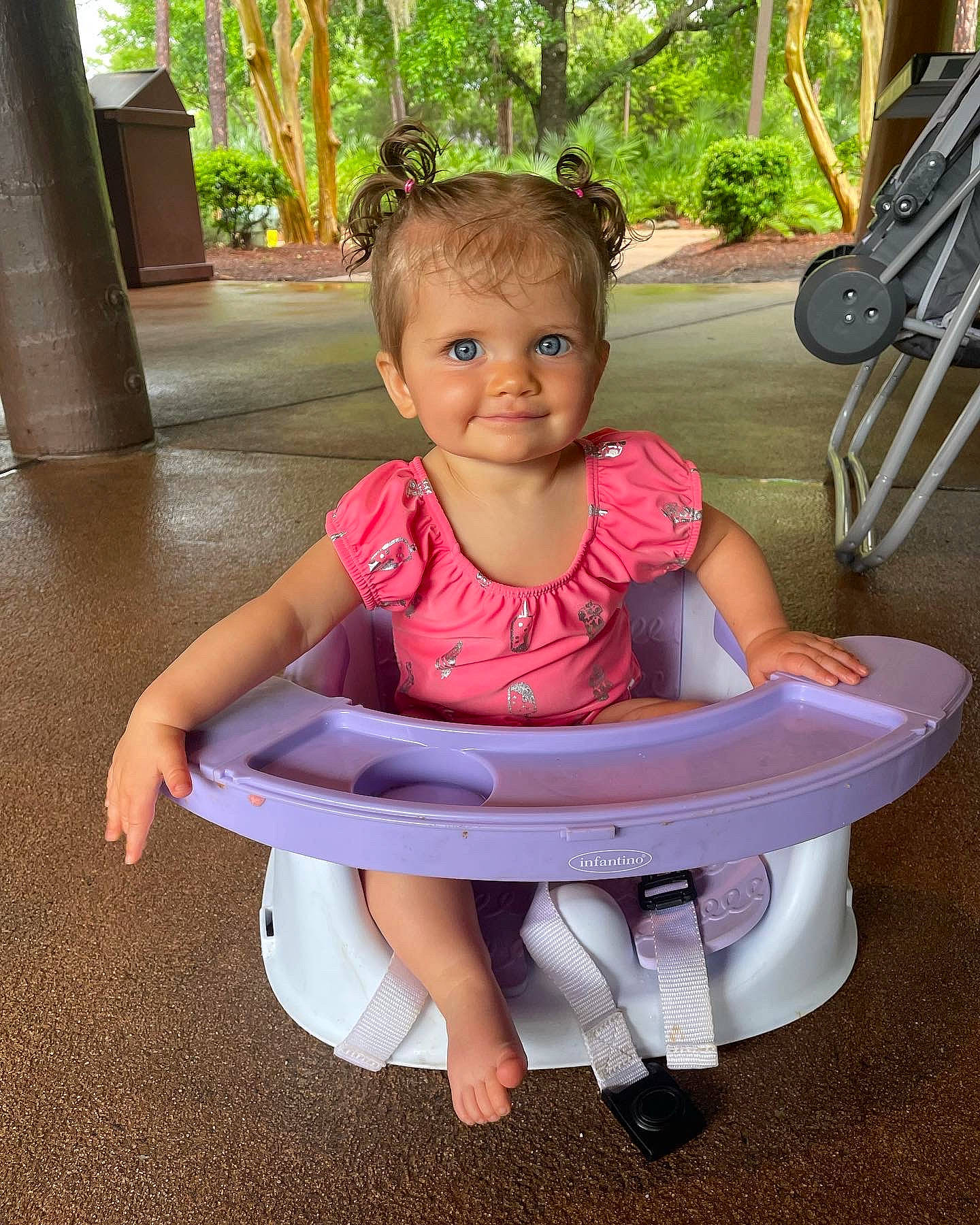 Bristol is registered to the contest to win money with this photo: baby, baby_toddler_clothing, child, comfort, fun, happy, head, human_leg, joy, lap, leisure, magenta, mammal, person, pink, plant, recreation, skin, smile, thigh