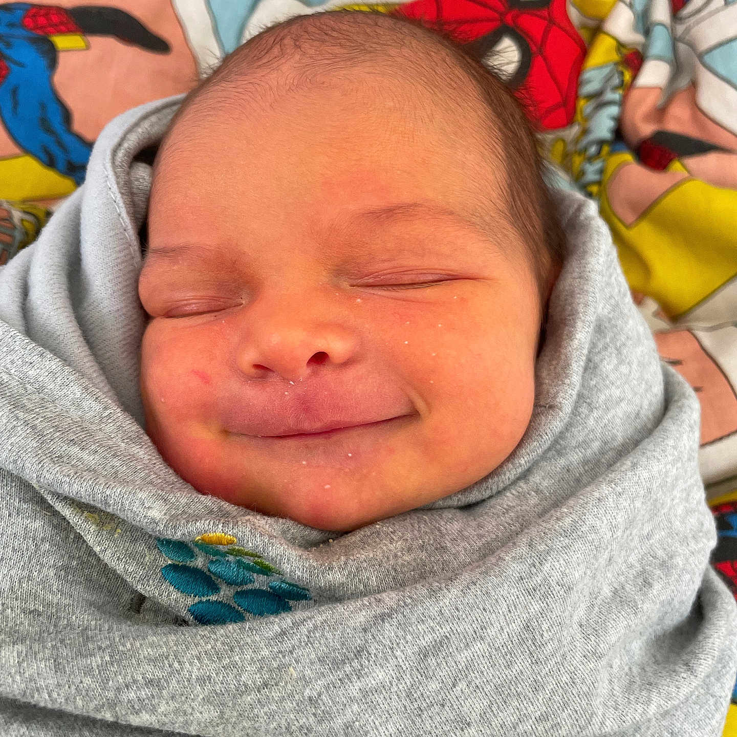 Jordi joined the competition — help win amazing prizes! baby, blanket, child, closeup, colorful, comfort, cozy, cute, fabric, face, indoors, infant, newborn, peaceful, portrait, sleeping, smile, soft, superhero, wrapped