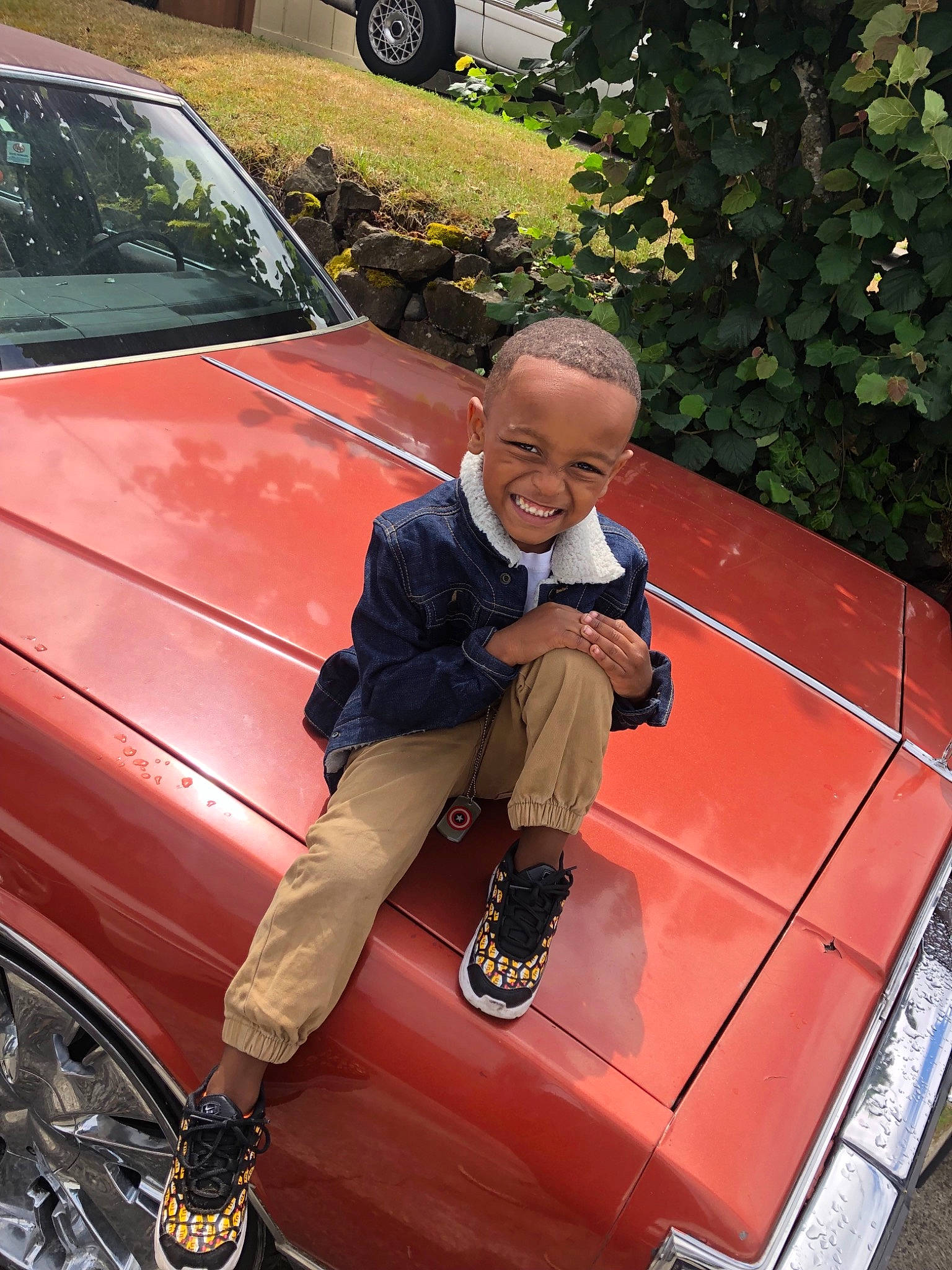 Lashawn is registered to the contest to win money with this photo: automotive_exterior, automotive_window_part, car, hood, joy, luxury_vehicle, mid_size_car, motor_vehicle, person, vehicle, vehicle_door