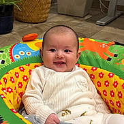 Florence joined the competition — help win amazing prizes! baby, smiling, infant, child, colorful, baby_seat, flowers, animal_print, indoors, happy, cute, clothing, white_sweater, playful, comfort, person, portrait, seated, face, joy