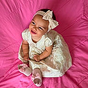 Lailah joined the competition — help win amazing prizes! baby, infant, child, dress, headband, bow, pink_blanket, shoes, smile, happy, cute, sitting, indoors, portrait, young_child, clothing, footwear, fabric, baby_girl, playful