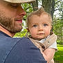 Oaklee joined the competition — help win amazing prizes! baby, man, outdoor, nature, trees, greenery, child, holding, blue_eyes, beard, cap, portrait, cute, infant, parent, love, casual_clothing, daylight, grass, smile