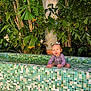 baby, child, colorful, cute, face, fun, greenery, happy, nature, outdoor, pigtails, plants, pool, portrait, sitting, smiling, sunlight, tiled_pool, tropical, water