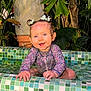 Maria participe au concours pour gagner de l'argent avec cette photo : baby, child, smiling, pool, water, wet_hair, pigtails, floral_swimsuit, greenery, plants, tiles, mosaic, outdoor, nature, happy, cute, portrait, sitting, playful, summer