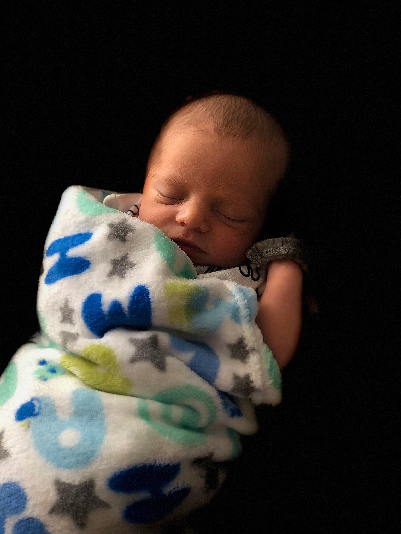 Atticus is registered to the contest to win money with this photo: baby, baby_toddler_clothing, cheek, child, chin, comfort, flash_photography, happy, iris, linens, neck, nose, pattern, person, plaid, portrait_photography, room, sitting, skin, sleeve