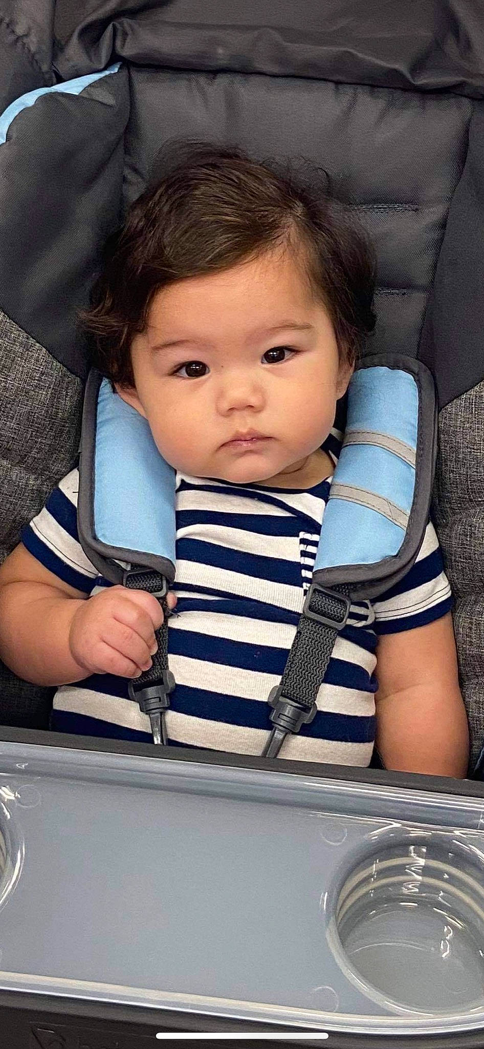 Skylar is registered to the contest to win money with this photo: automotive_design, baby, baby_carriage, baby_toddler_clothing, car_seat, cheek, child, comfort, cool, electric_blue, eyelash, facial_expression, hairstyle, hood, human, person, product, skin, toddler, travel