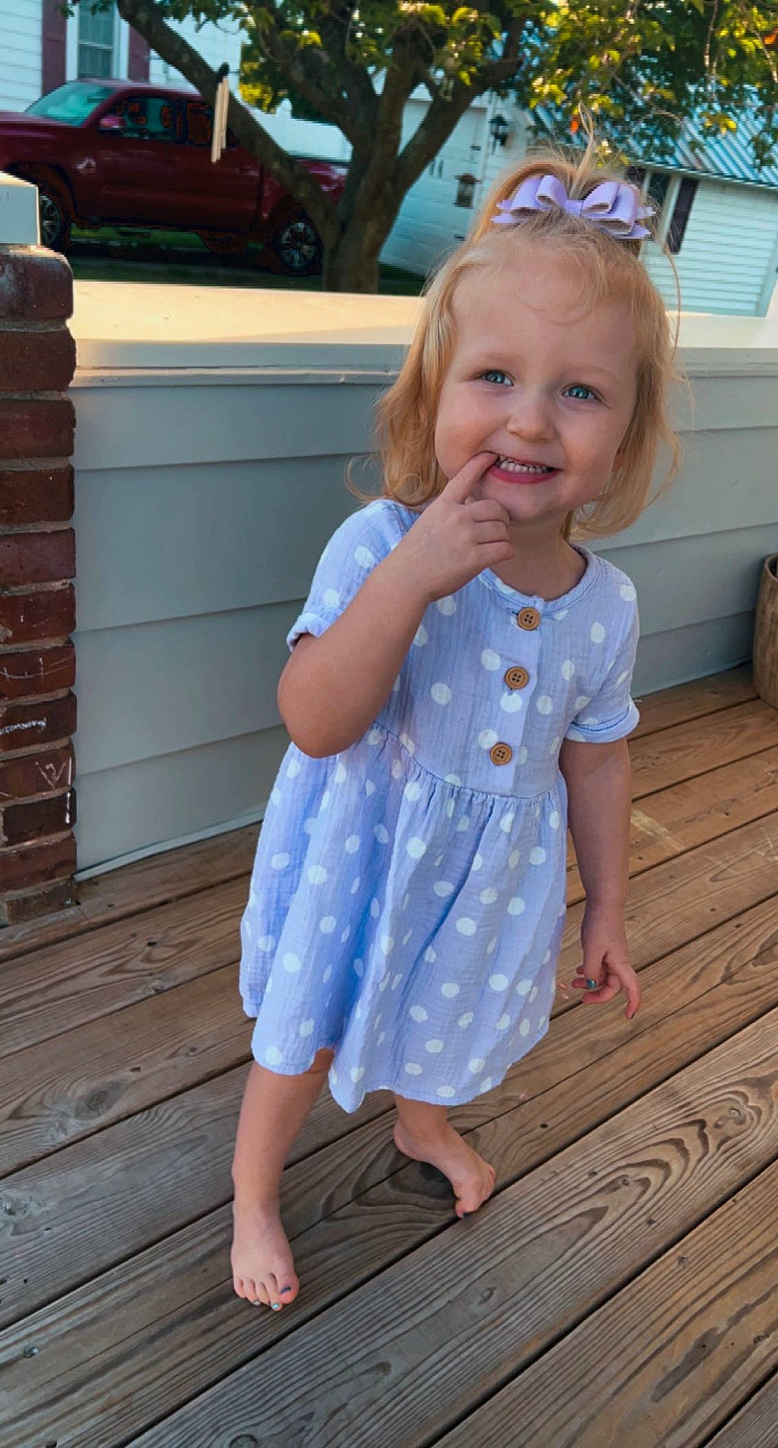 Harper is registered to the contest to win money with this photo: baby_toddler_clothing, barefoot, blue, day_dress, electric_blue, flooring, fun, hair, happy, joy, leg, pattern, person, pink, shoulder, skin, sleeve, smile, snapshot, standing