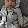 Grayson-Jo joined the competition — help win amazing prizes! baby, child, hoodie, grey_clothing, sitting, bed, curious, face, blue_eyes, indoor, person, casual_wear, shorts, hand, soft_lighting, young_child, infant, cute, portrait, comfortable