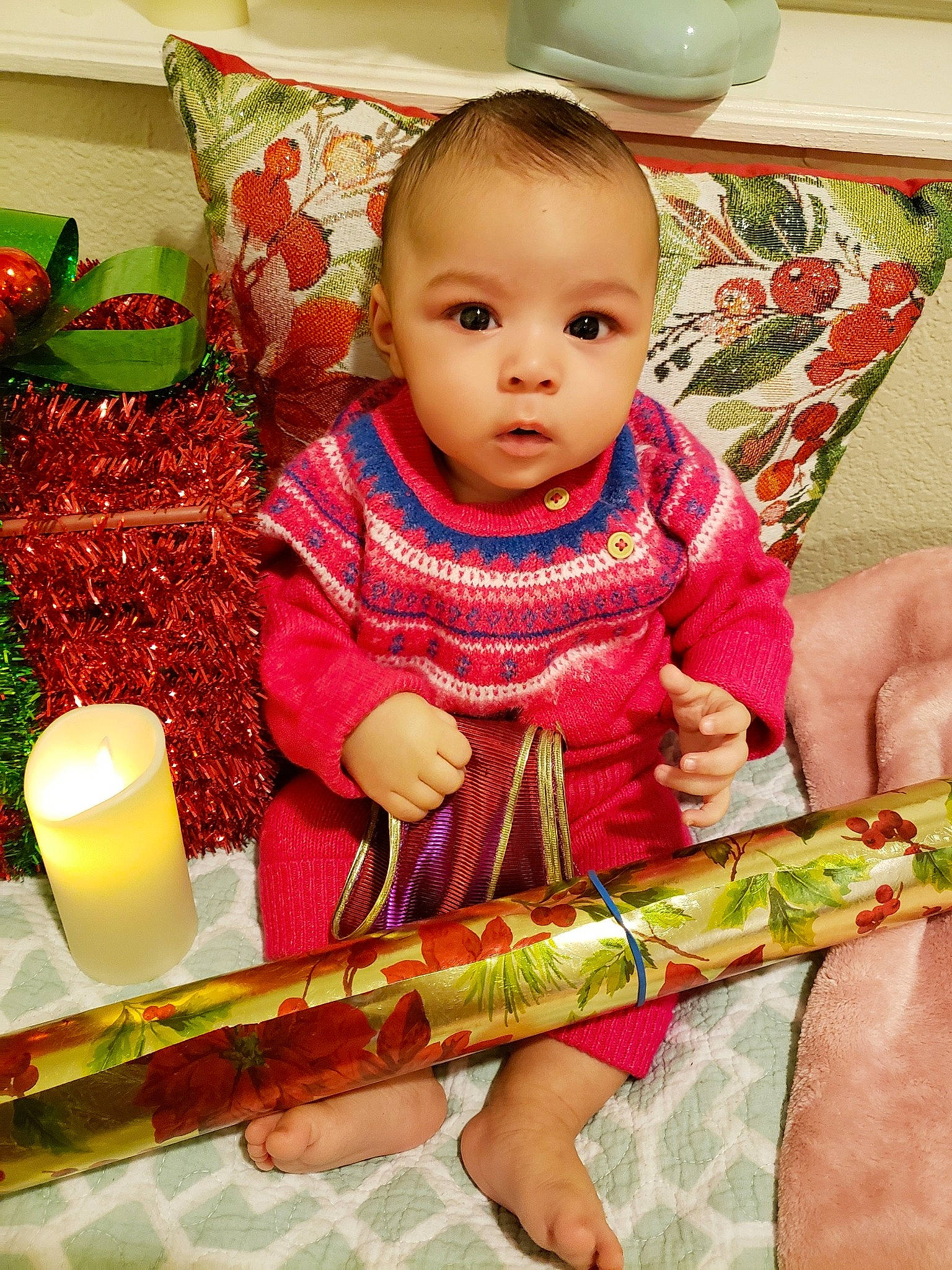 Nehemiah is registered to the contest to win money with this photo: baby, baby_toddler_clothing, chair, cheek, child, event, flooring, happy, linens, magenta, pattern, person, plant, room, sitting, skin, sleeve, textile, toddler, tradition