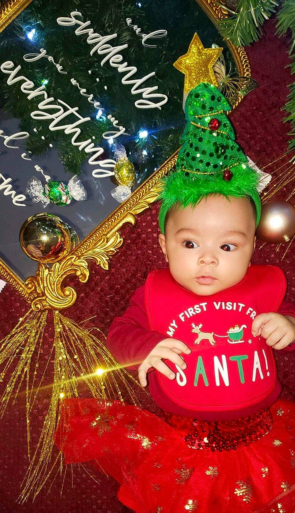 Nehemiah is registered to the contest to win money with this photo: art, baby, baby_toddler_clothing, christmas, christmas_decoration, christmas_eve, christmas_ornament, christmas_tree, conifer, costume_hat, event, fictional_character, fir, happy, holiday, holiday_ornament, interior_design, ornament, person, souvenir