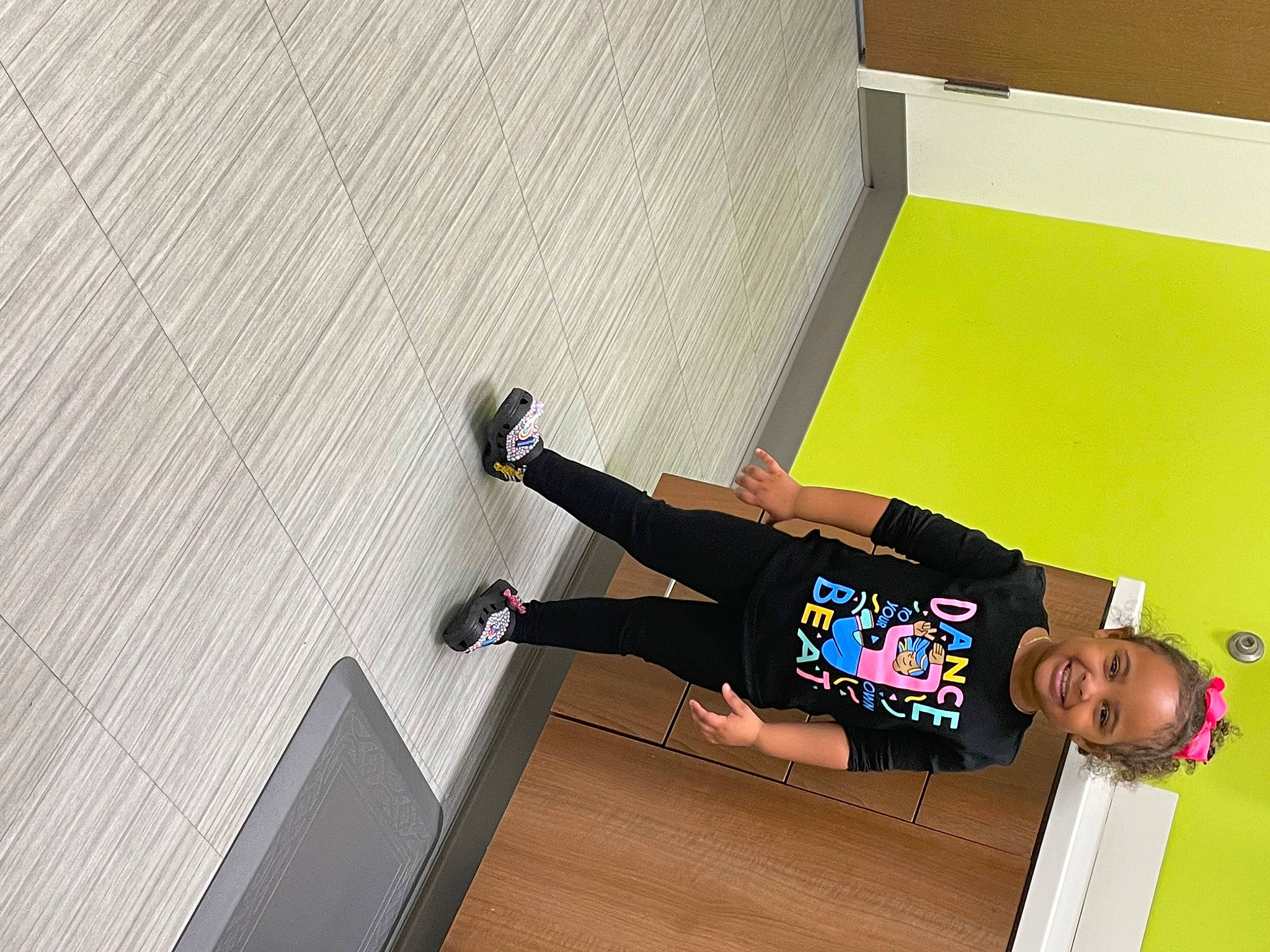 Nala is registered to the contest to win money with this photo: balance, cleanliness, elbow, flooring, fun, hardwood, joy, knee, person, room, sleeve, smile, t_shirt, varnish, walking_shoe, wood, wood_flooring, wrist