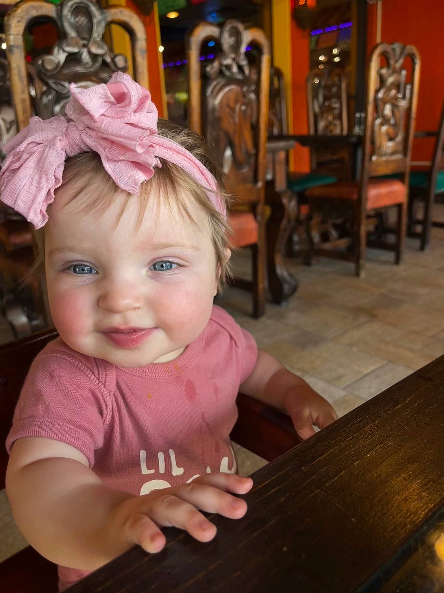 Ila is registered to the contest to win money with this photo: baby, baby_toddler_clothing, chair, cheek, child, chin, fashion_accessory, fun, hair_accessory, happy, headpiece, headwear, iris, joy, leisure, magenta, person, play, sitting, smile