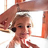 Kaylena is registered to the contest to win money with this photo: child, toddler, face, smiling, portrait, makeup, makeup_brush, adult, hands, indoor, window, sunlight, warm_lighting, blonde_hair, white_shirt, seated, closeup, family, home, photography