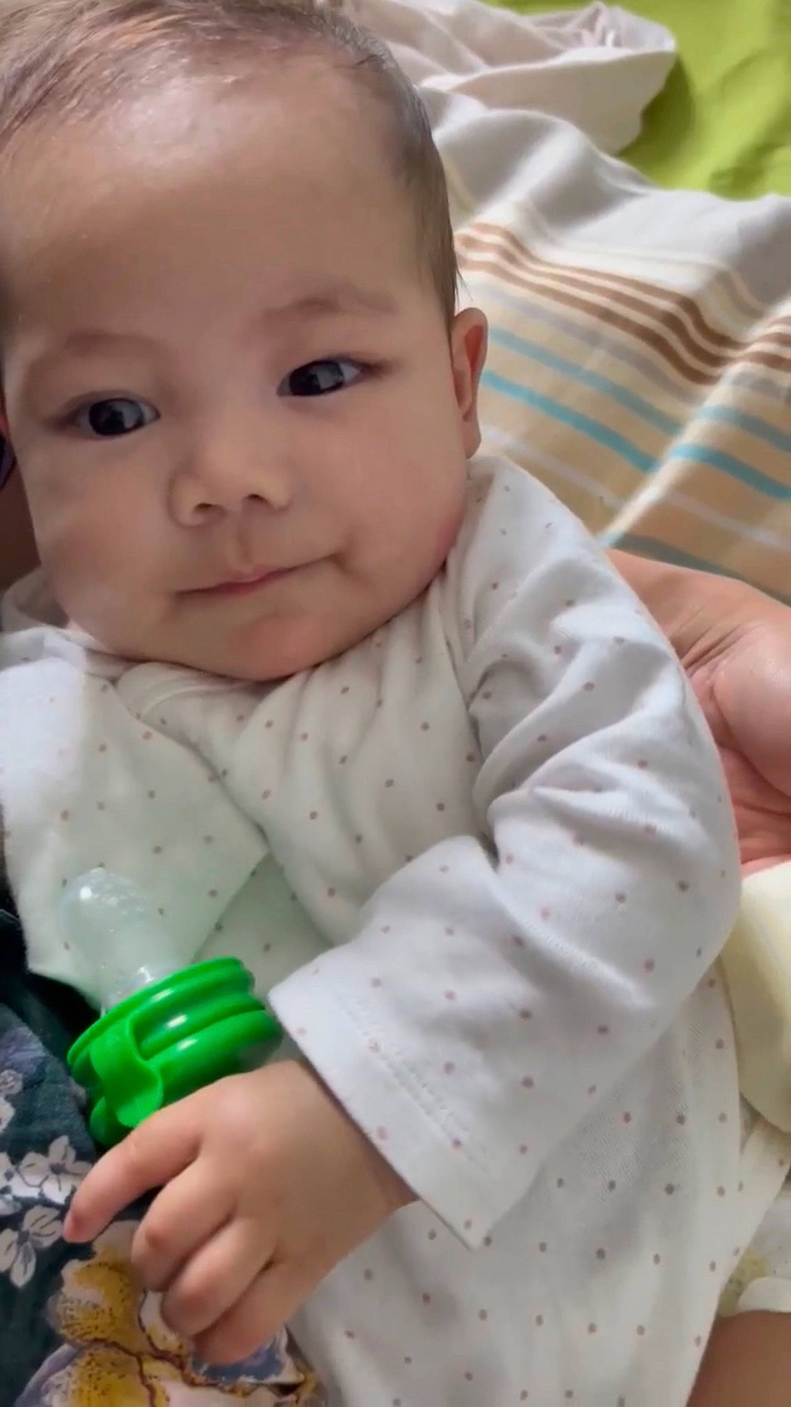 Freya is registered to the contest to win money with this photo: baby, baby_products, baby_toddler_clothing, cheek, child, chin, comfort, finger, grass, happy, iris, nose, person, sitting, skin, sleeve, smile, thumb, toddler, tummy_time