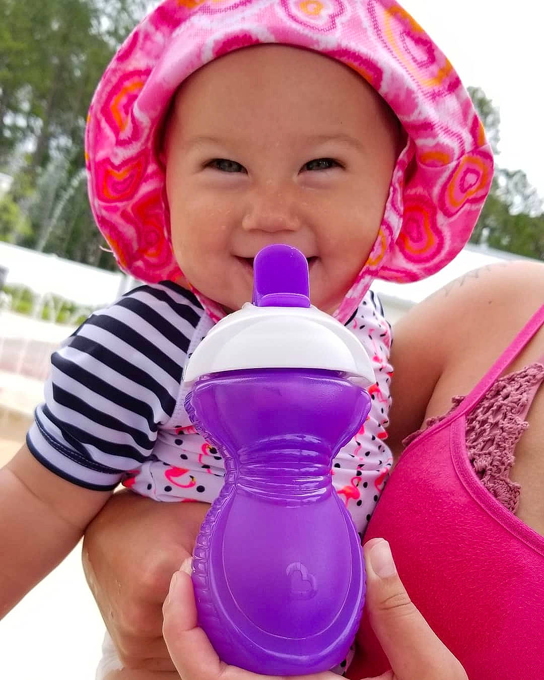 Skye'Lynn is registered to the contest to win money with this photo: baby_products, child, drinking, headwear, joy, magenta, neck, person, pink, product, toddler, water, water_bottle