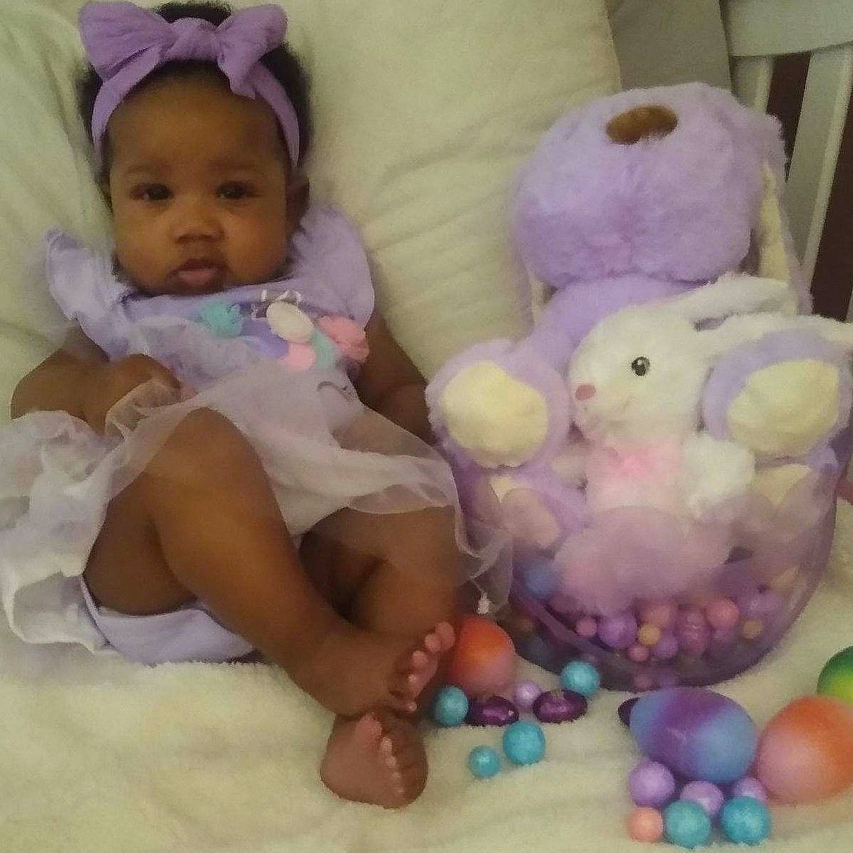 Emani is registered to the contest to win money with this photo: baby, baby_products, baby_toys, birth, cheek, child, easter, holiday, person, pink, play, product, purple, skin, smile, stuffed_toy, toddler, toy