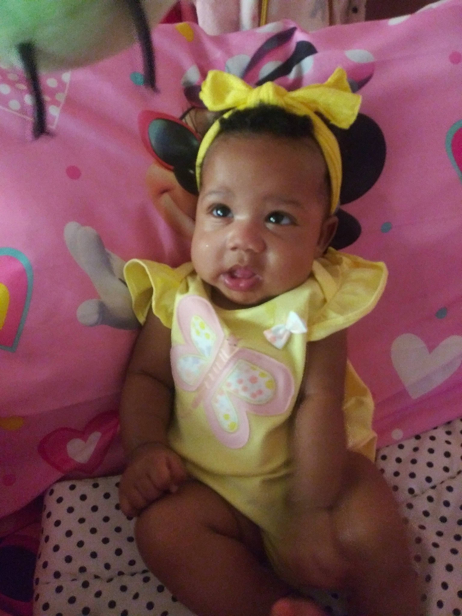 Emani is registered to the contest to win money with this photo: baby, baby_products, baby_toddler_clothing, child, eye, face, head, iris, neck, person, pink, product, skin, smile, textile, toddler, yellow