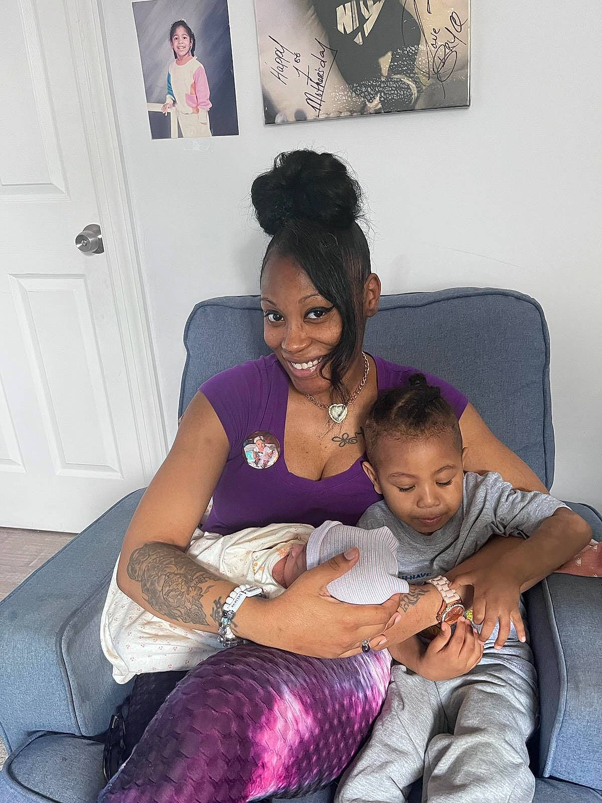 Brielle joined the competition — help win amazing prizes! abdomen, black, black_hair, child, comfort, door, event, happy, human_leg, interaction, jewellery, joy, knee, lap, person, purple, sitting, smile, thigh, toddler