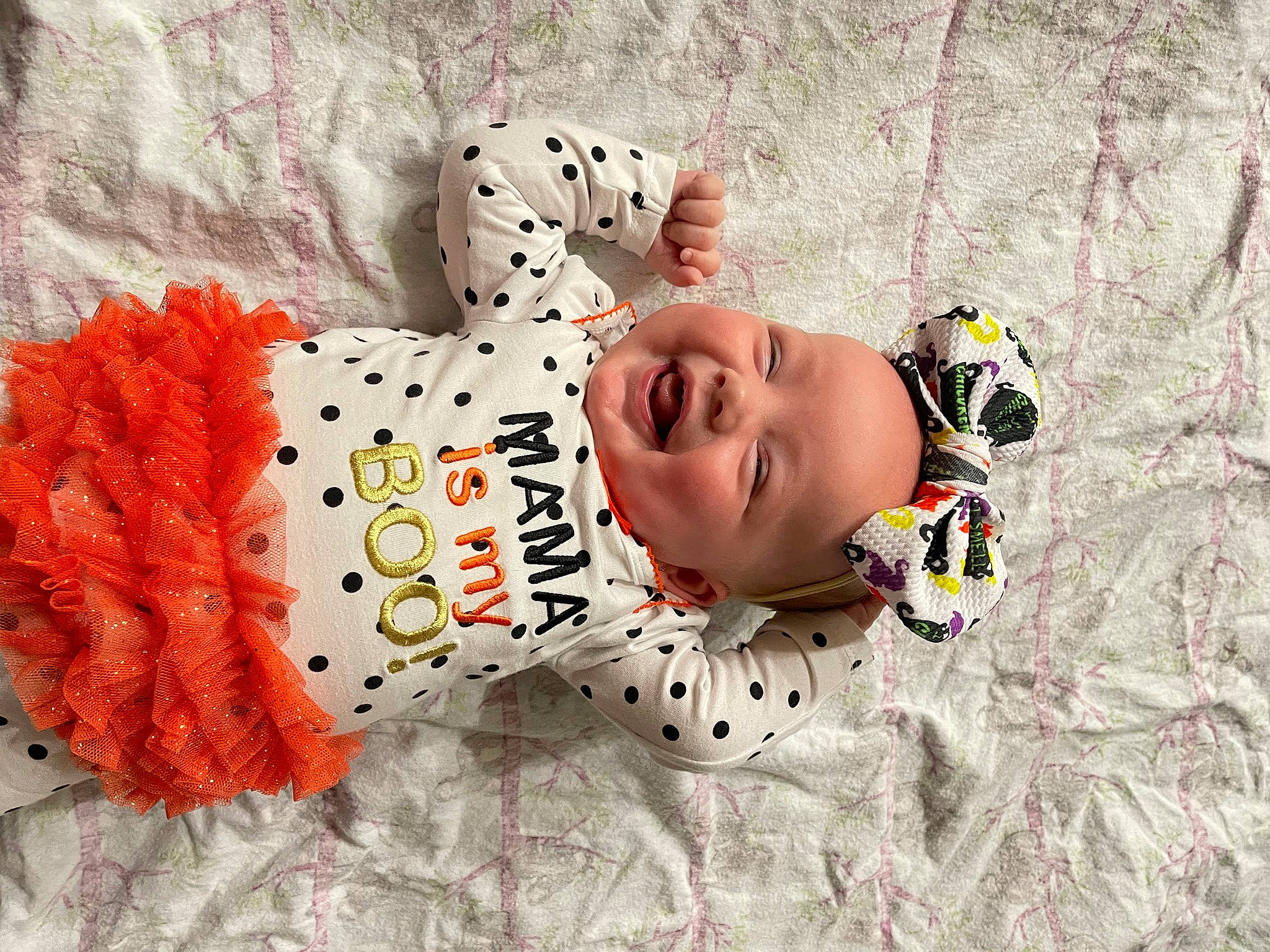 Ireland is registered to the contest to win money with this photo: baby, baby_products, baby_toddler_clothing, child, creative_arts, font, happy, headgear, headwear, linens, pattern, person, polka_dot, sleeve, smile, toddler