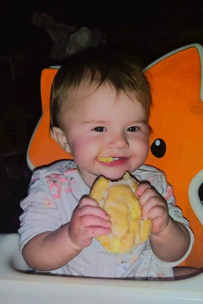 Alicia is registered to the contest to win money with this photo: arm, baby, baby_playing_with_toys, baby_toddler_clothing, cheek, child, finger, fun, gesture, hand, happy, iris, joy, mouth, nose, orange, person, skin, smile, textile