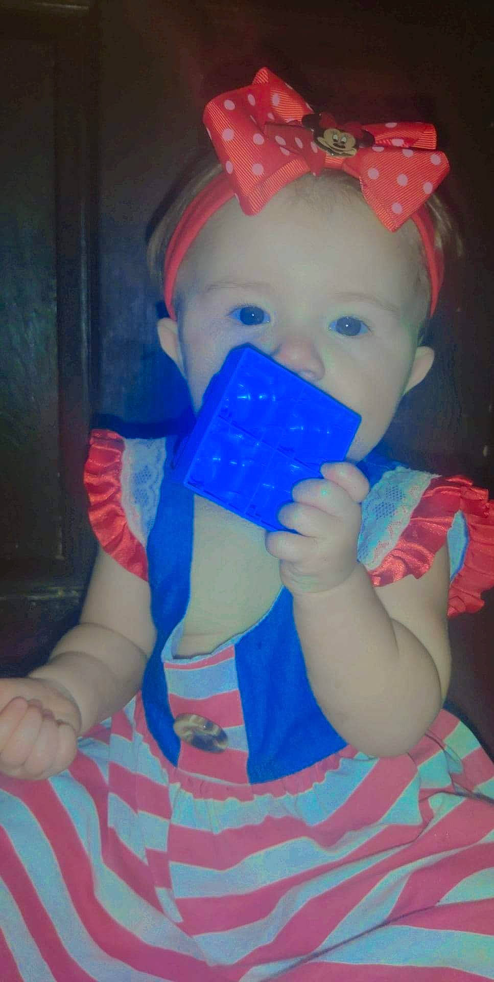 Alicia is registered to the contest to win money with this photo: baby, baby_products, baby_toddler_clothing, baby_toys, child, drinkware, electric_blue, fictional_character, finger, fun, hand, happy, nail, person, plastic, play, sitting, sleeve, smile, thumb