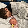 Rayleigh joined the competition — help win amazing prizes! infant, child, sleeping, blanket, pacifier, hospital, medical_tape, bed, couch, cozy, tender_moment, family, care, resting, indoor, soft_texture, person, head, pink_clothing, love