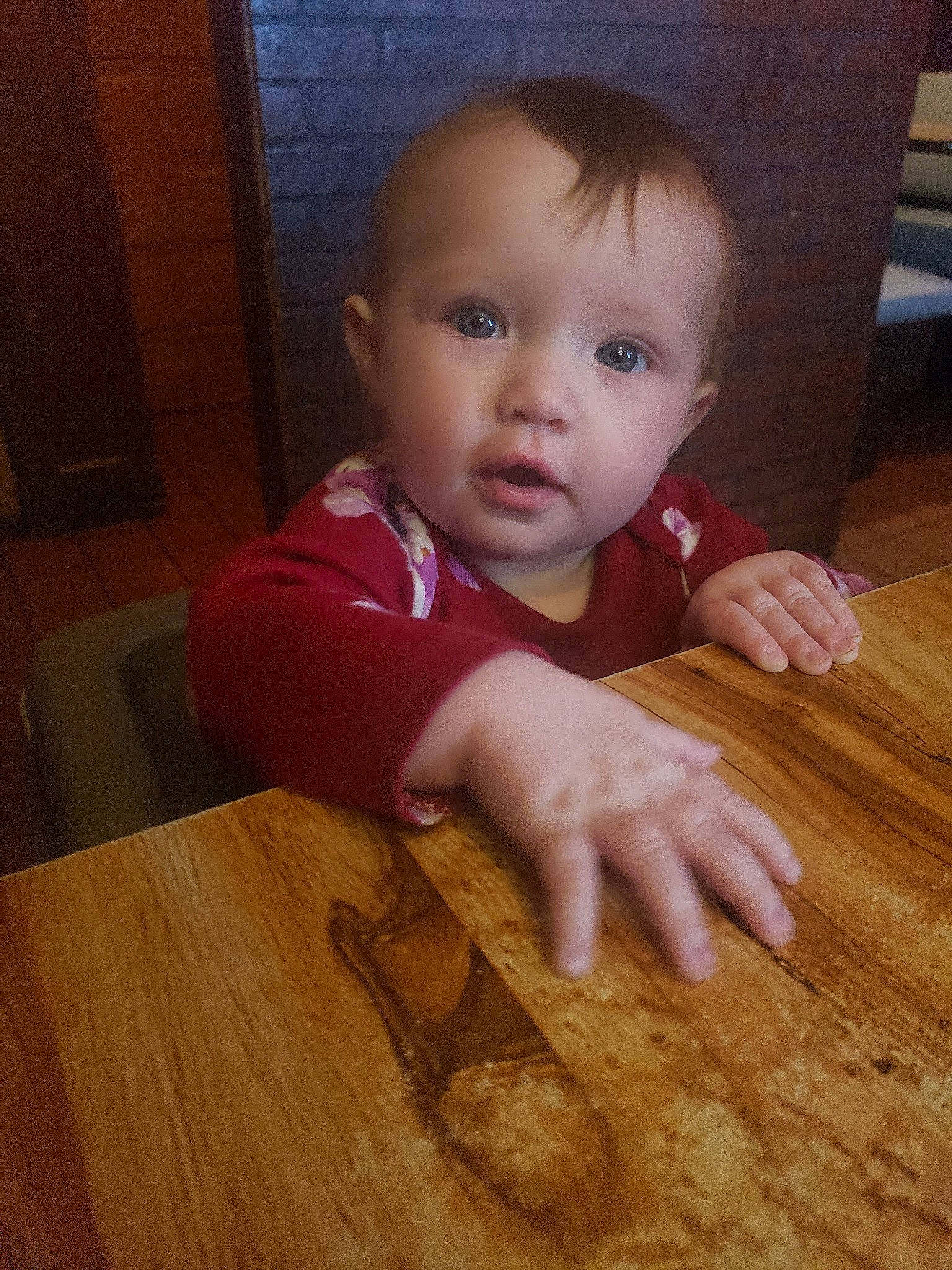 Mia Maze is registered to the contest to win money with this photo: baby, cheek, child, eye, face, finger, floor, flooring, hardwood, head, lip, mouth, nose, person, play, skin, smile, toddler, wood
