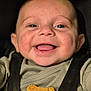 baby, baby_accessory, baby_boy, baby_clothes, black_background, bright_eyes, child, close_up, clothing, cute, cute_expression, face, happiness, indoor, infant, portrait, smiling, soft_lighting, wooden_toy, young