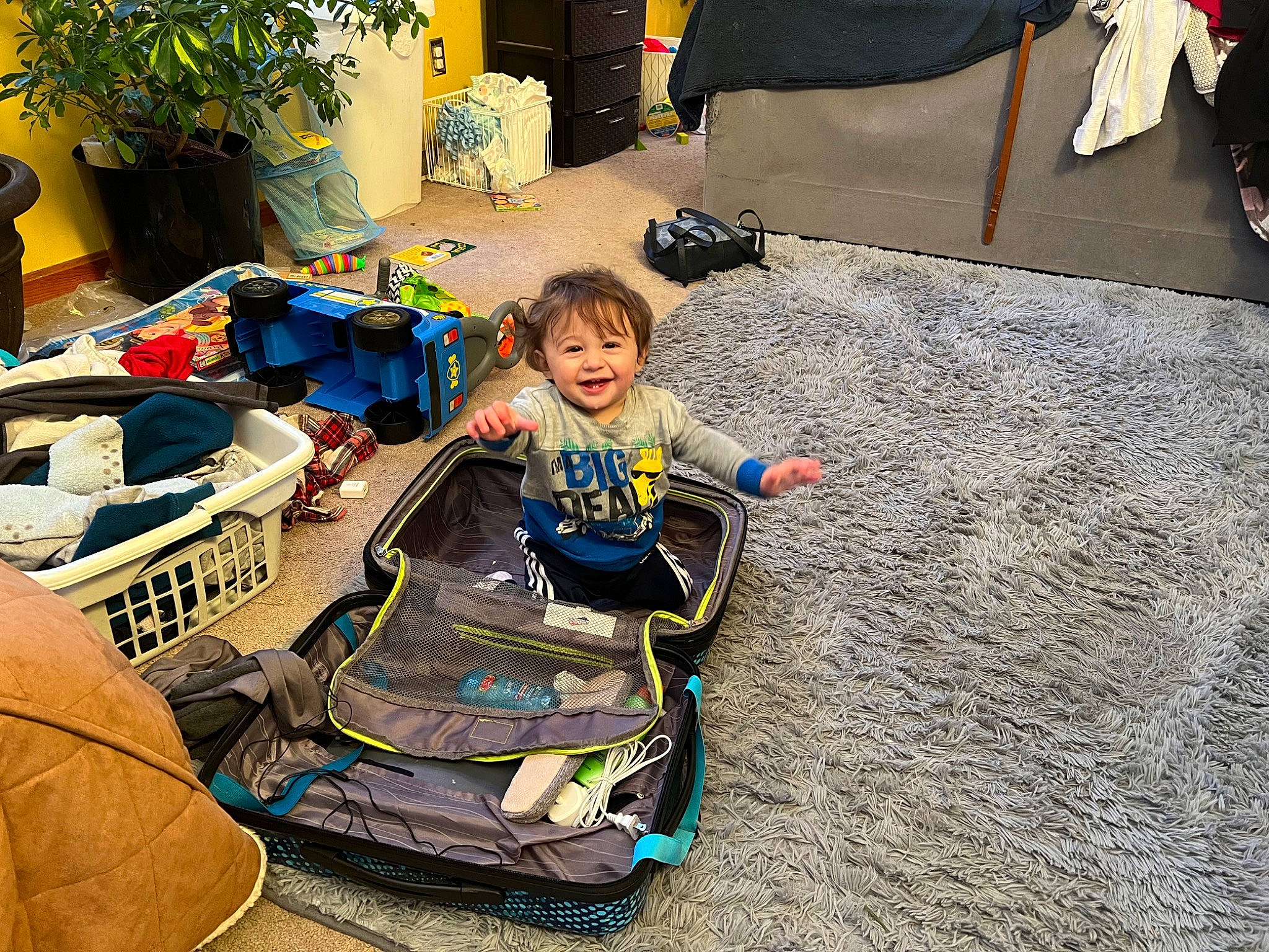 Evan joined the competition — help win amazing prizes! asphalt, automotive_tire, baby_products, chair, child, flooring, fun, houseplant, joy, leisure, person, personal_protective_equipment, play, recreation, sitting, smile, soil, t_shirt, toddler, yard
