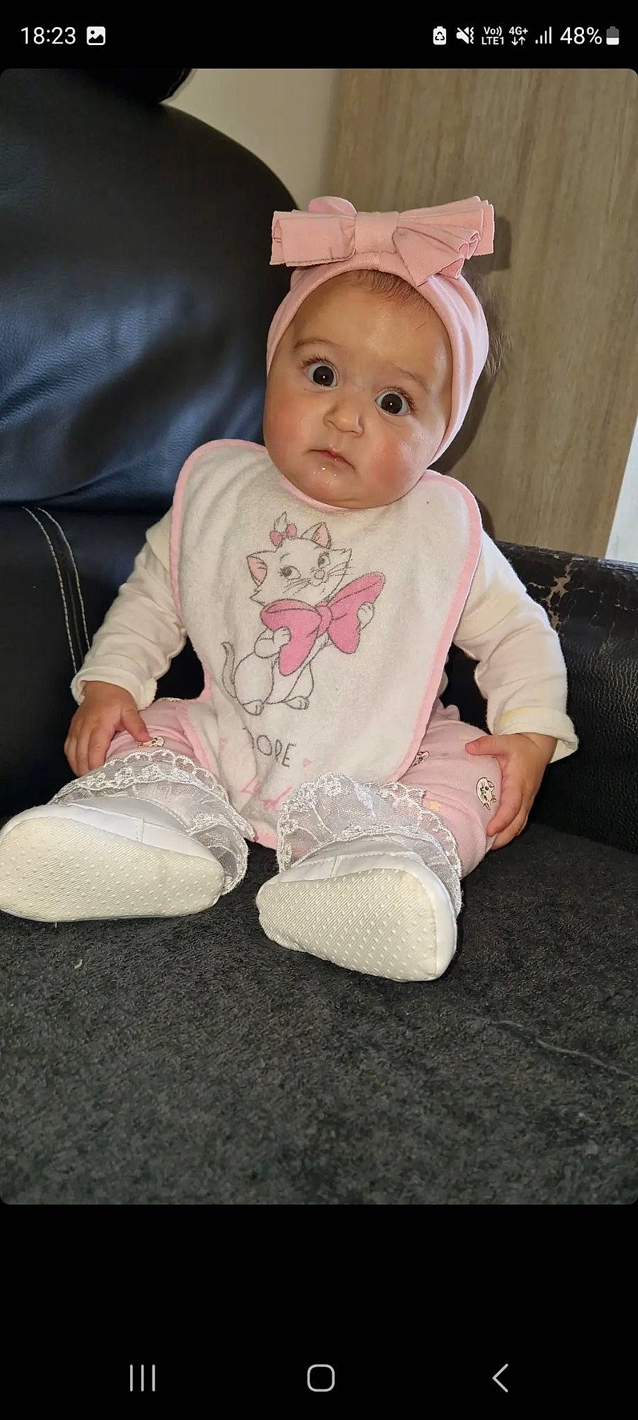 Shelsy participe au concours pour gagner de l'argent avec cette photo : baby, baby_toddler_clothing, cheek, child, comfort, costume_hat, eye, fashion_accessory, flooring, foot, hat, linens, pattern, person, sitting, skin, sleeve, sock, toddler