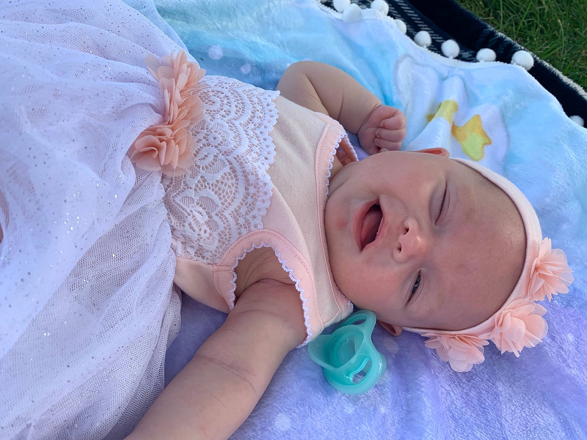Brielle is registered to the contest to win money with this photo: baby, baby_toddler_clothing, child, comfort, embellishment, eyelash, fashion_accessory, grass, hair_accessory, happy, headgear, headpiece, headwear, jewellery, linens, pattern, person, pink, purple, skin