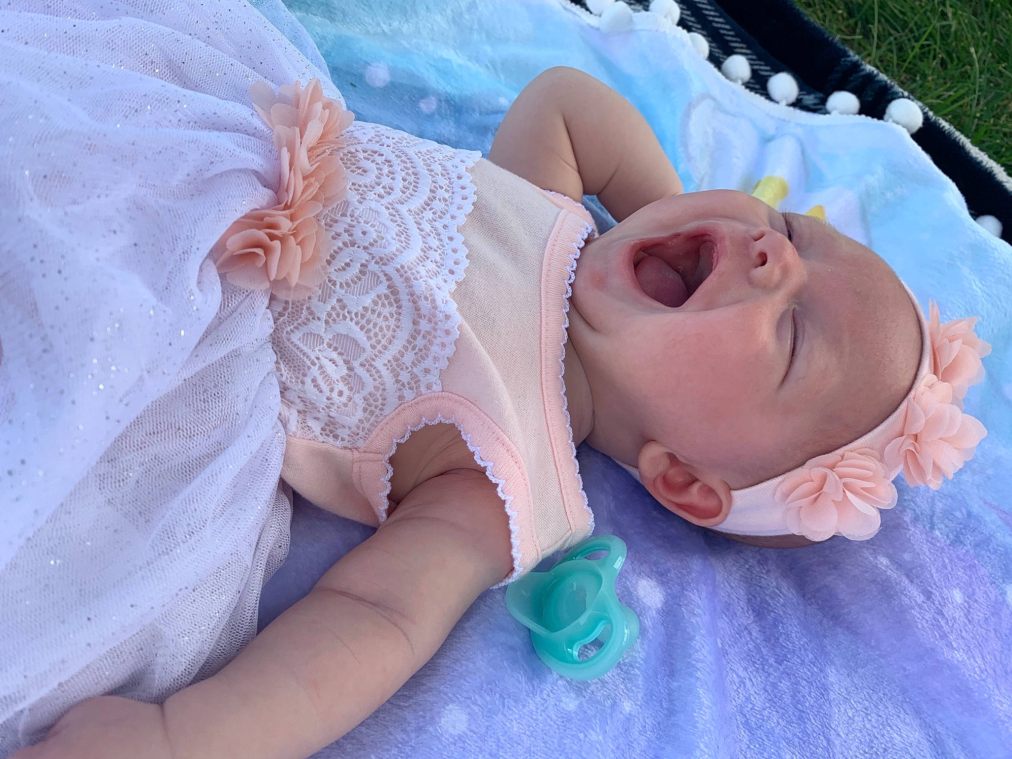 Brielle is registered to the contest to win money with this photo: baby, baby_toddler_clothing, bridal_accessory, child, comfort, dress, embellishment, finger, grass, hair_accessory, hand, happy, head, headgear, headpiece, jewellery, linens, person, pink, skin