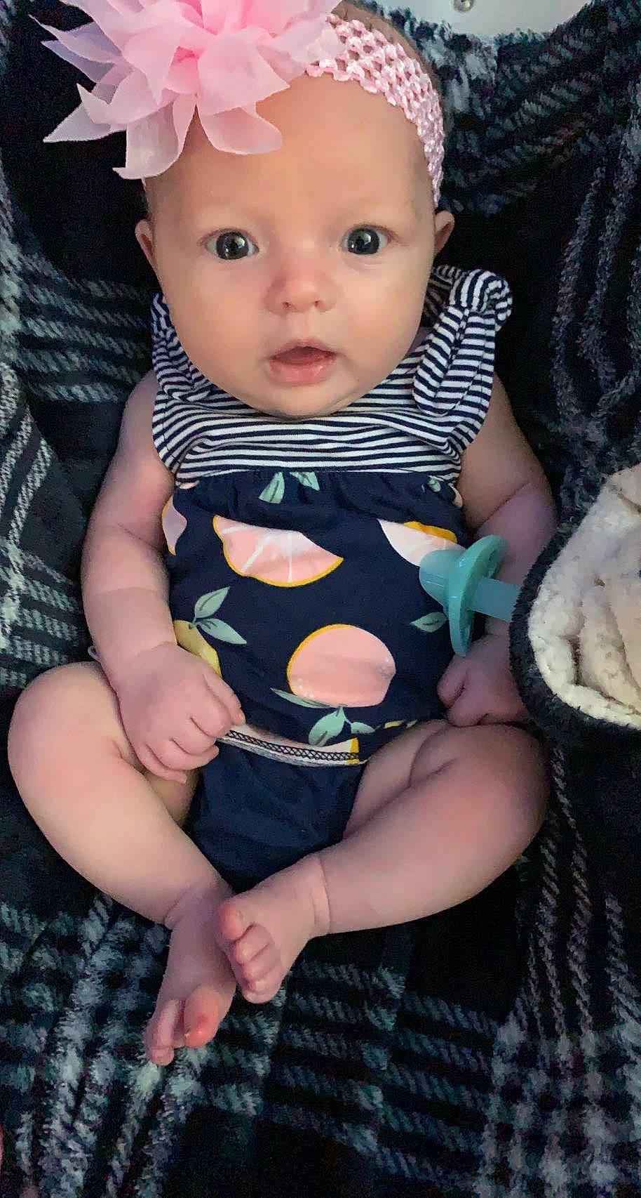 Brielle joined the competition — help win amazing prizes! baby, baby_toddler_clothing, beauty, cheek, child, dress, eye, eyelash, finger, flash_photography, hand, happy, head, headwear, iris, pattern, person, pink, sitting, skin